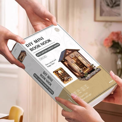 DIY Mini Book Nook packaging held by hands with a blurred indoor background