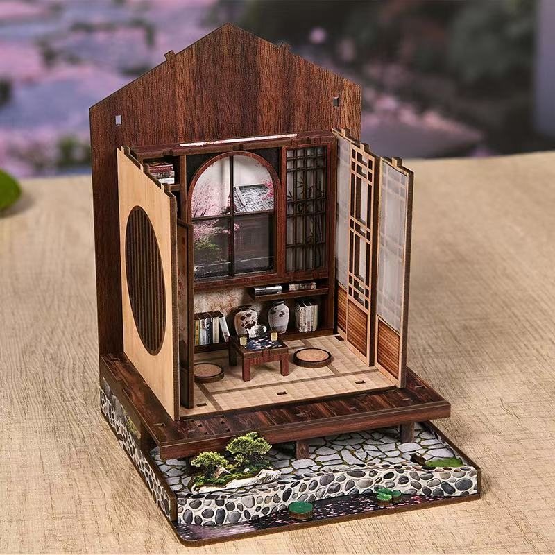 half-finished Wooden model of a traditional Japanese house with open doors on table