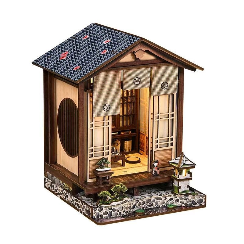 Miniature model of a traditional Japanese house with detailed interior and exterior.