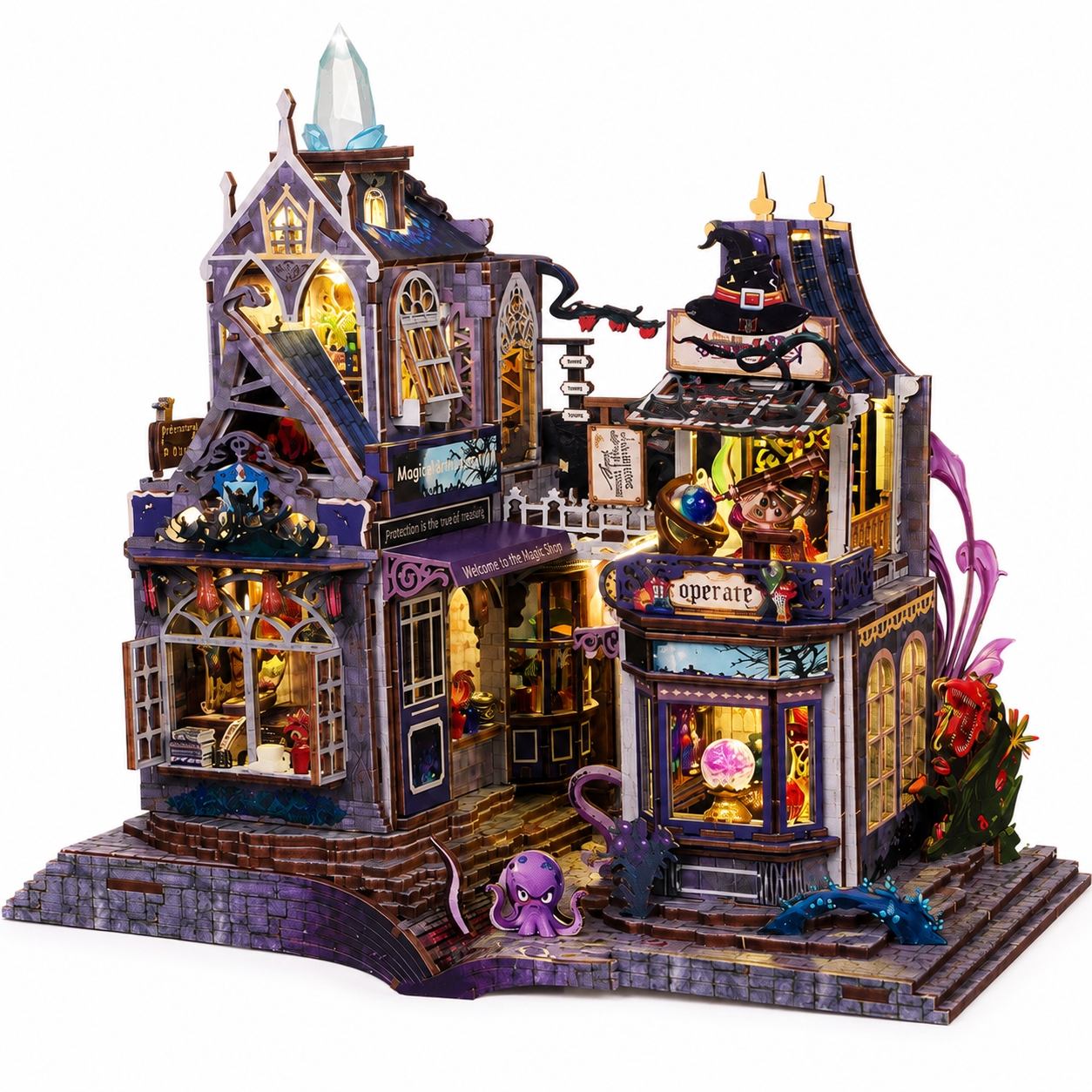 A detailed 3D wooden puzzle model of a whimsical, gothic-style haunted house with miniature details, lit windows, and small fantasy creatures, shown on a plain white background.