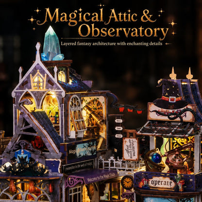 A highly detailed, illuminated wooden model of a 'Magical Attic & Observatory' fantasy building set against a dark, starry background. The model features intricate layers, glowing warm yellow windows, a blue crystal tower, and whimsical details like a witch's hat, a telescope, and flying bats, with decorative text overlays at the top.