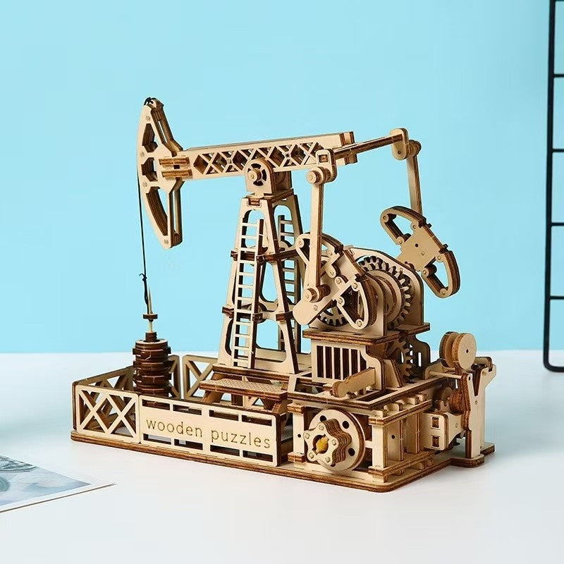 image displayed different side views of the finished Oil Derrick 3D Wooden Puzzle on table