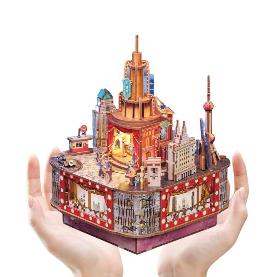 image displaying the assembled Paramount Ballroom DIY Music Box 3D Puzzle Kit holding with hands