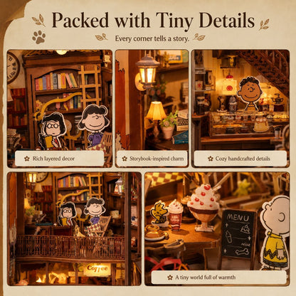 Miniature model of Peanuts cozy cafe with detailed decor, featuring cartoon characters.