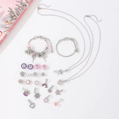 Jewelry set with necklaces and charms on a light background