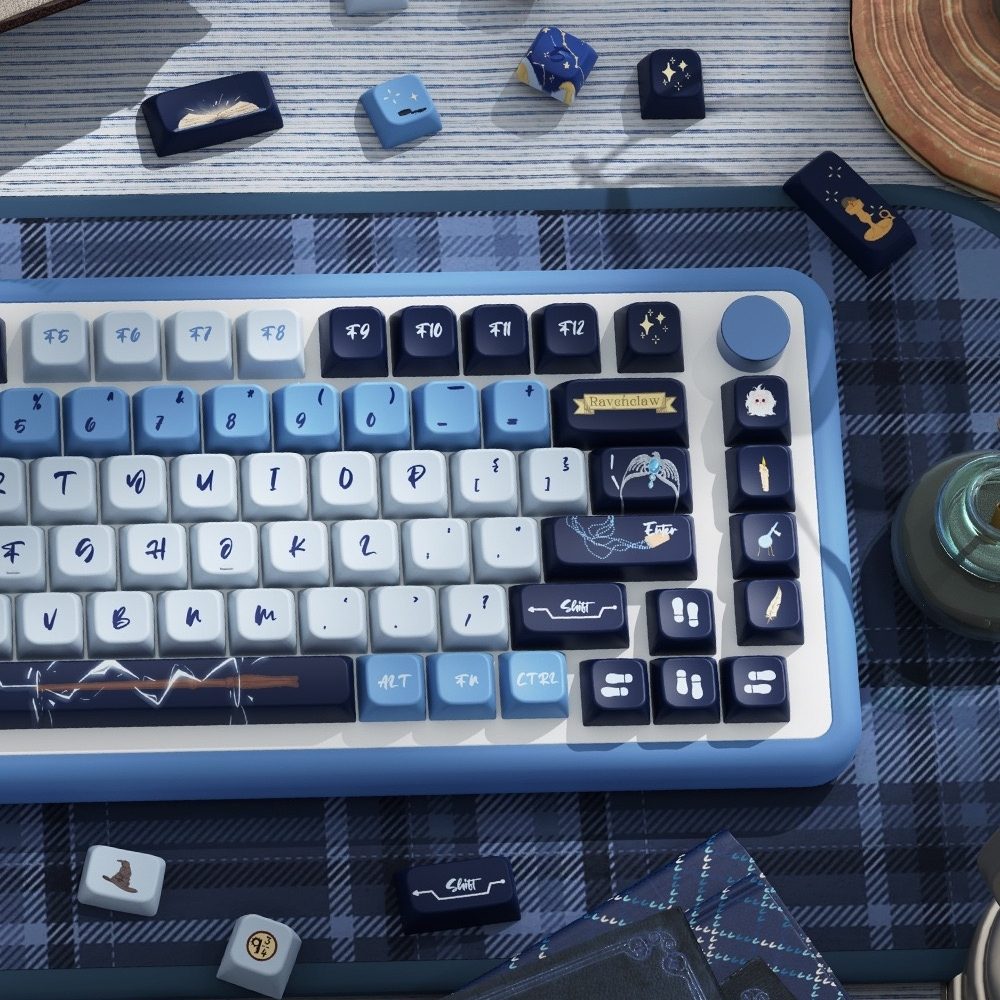 Keyboard with decorative keycaps Inspired by one of the iconic Hogwarts house Ravenclaw on a checkered tablecloth
