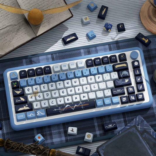 Keyboard with decorative keys Inspired by one of the iconic Hogwarts Ravenclaw house on a table with gaming accessories