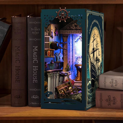 image displaying finished Riddle on the Seabed DIY Book Nook Kit in bookshelf setting