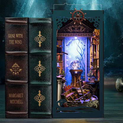 image displaying finished Riddle on the Seabed DIY Book Nook Kit in bookshelf setting