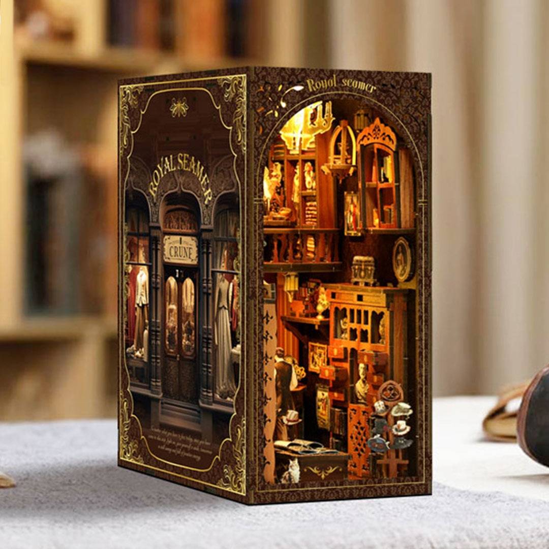 image displaying the left side view of assembled Royal Tailor Shop DIY Book Nook Kit in a table setting