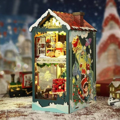 image displaying right side of the assembled Santa's Christmas House DIY Book Nook Kit in a Christmas-themed table setting