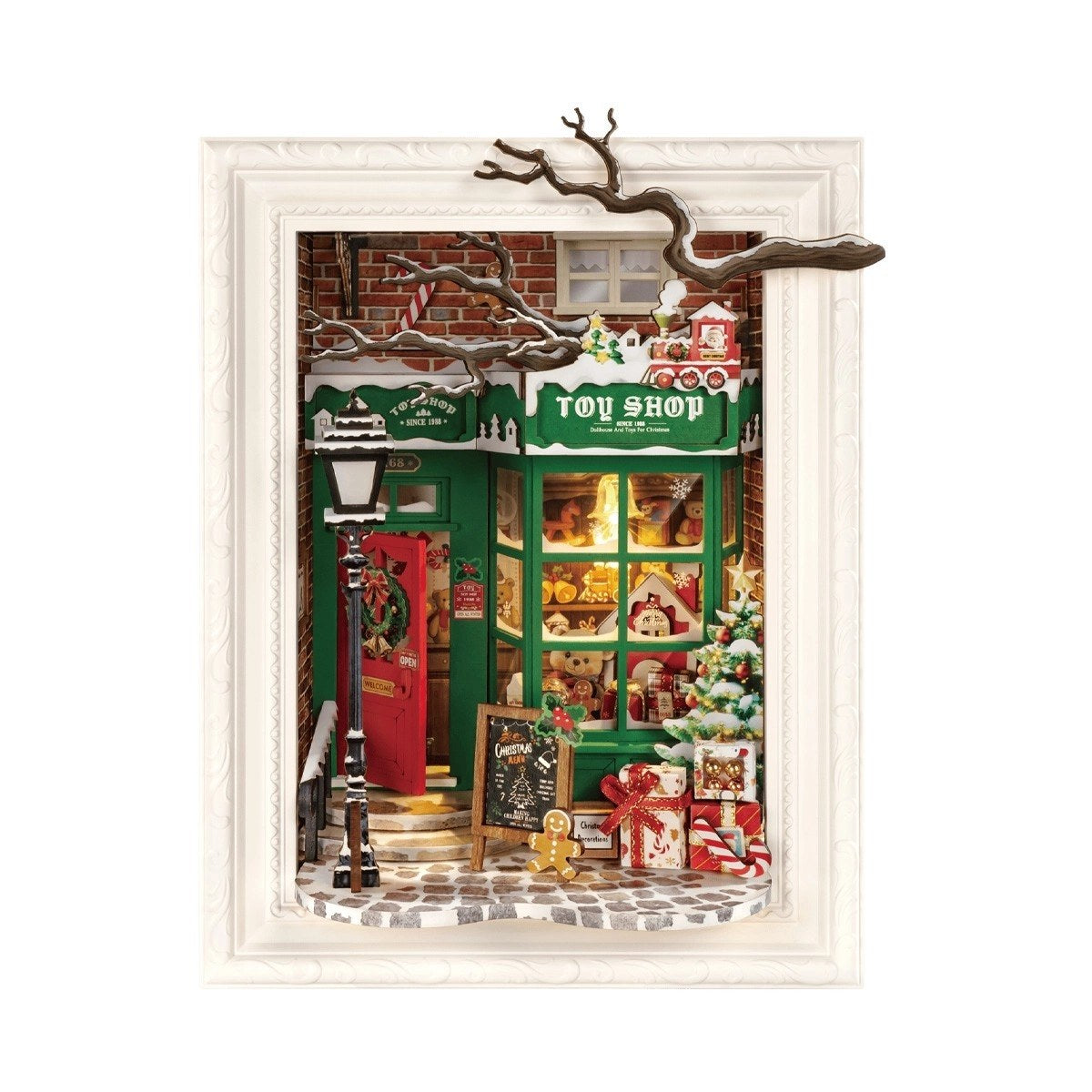 Miniature Christmas toy shop scene with a green door and festive decorations.