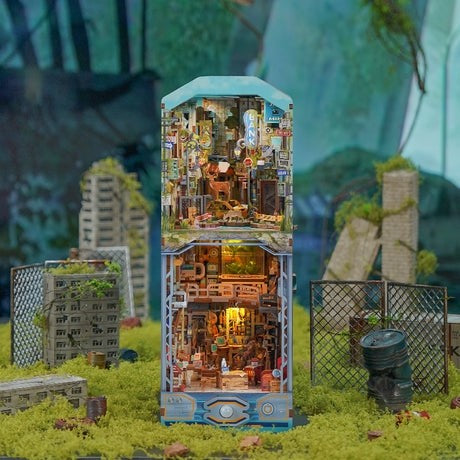 image displaying the front side of finished Shelter Zero DIY Book Nook Kit  in a post-disaster themed setting