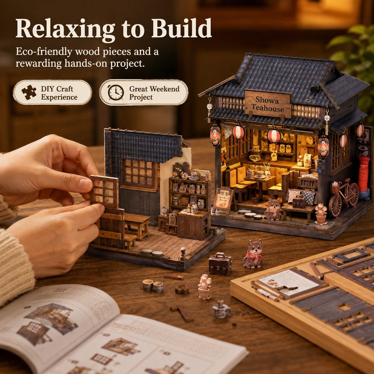 A person's hands are shown assembling a wooden miniature tea house kit on a wooden table, with the completed glowing tea house and scattered wooden pieces in the foreground. Text on the image reads 'Relaxing to Build' and 'Eco-friendly wood pieces and a rewarding hands-on project.