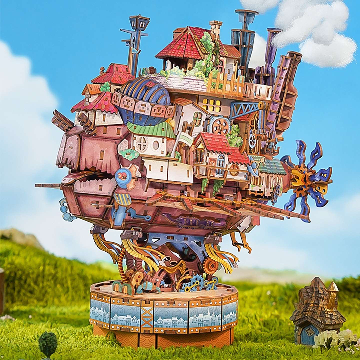 Fantasy toy Skybound Village with detailed architecture on a grassy field with a blue sky background
