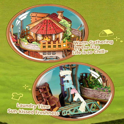 Illustration of a cozy Skybound Village miniature with a fireplace and laundry scene on a green background.