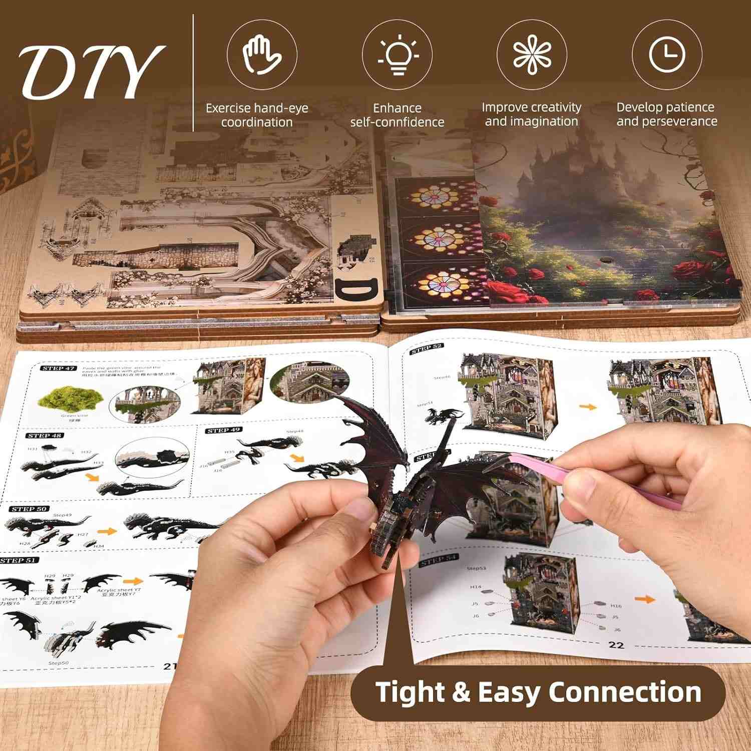 Hands assembling the miniature dragon of Sleeping Beauty Book Nook with an open book displaying diagrams and instructions