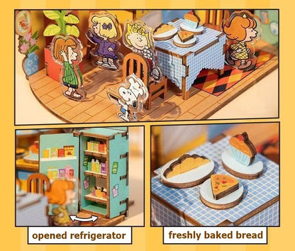Miniature diorama with characters inspired by "Peanuts" around a table, an opened refrigerator, and freshly baked bread.