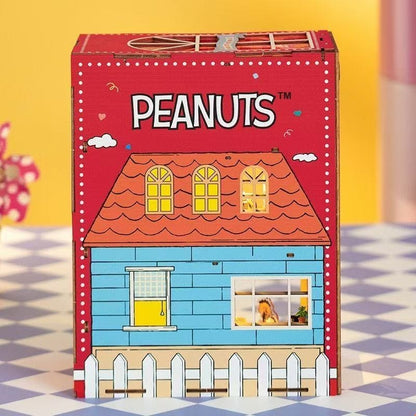 Peanuts-themed miniature house model kit with a red roof and blue body