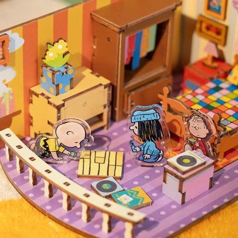 Snoopy-inspired Miniature model of a bedroom with "Peanuts" cartoon characters and furniture