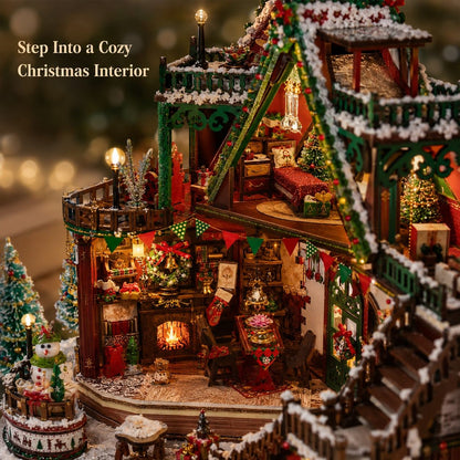 A detailed miniature Christmas village diorama with a cozy multi-level gingerbread house, warm glowing windows, snow-dusted roofs, small Christmas trees, stockings, and festive decorations. Text in the upper left reads 'Step Into a Cozy Christmas Interior'.