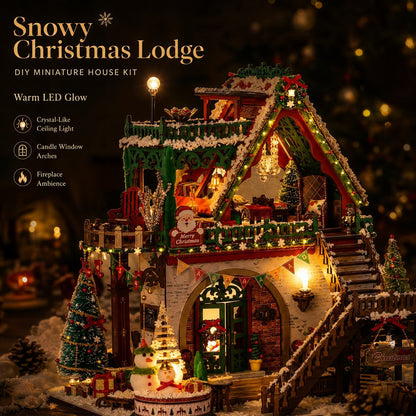 A festive DIY miniature house kit labeled 'Snowy Christmas Lodge' shown fully assembled with warm glowing lights, snow-covered details, Christmas trees, a fireplace, and holiday decorations against a dark blurred background.
