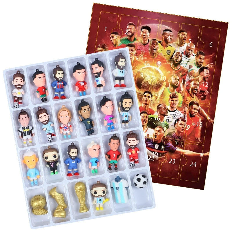 Collection of soccer-themed figurines in a advent calendar box in the background.