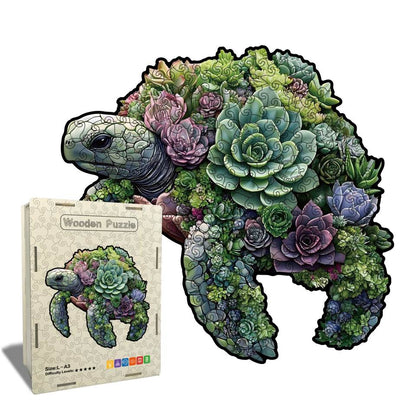 Wooden puzzle shaped like a turtle with succulent design on a white background