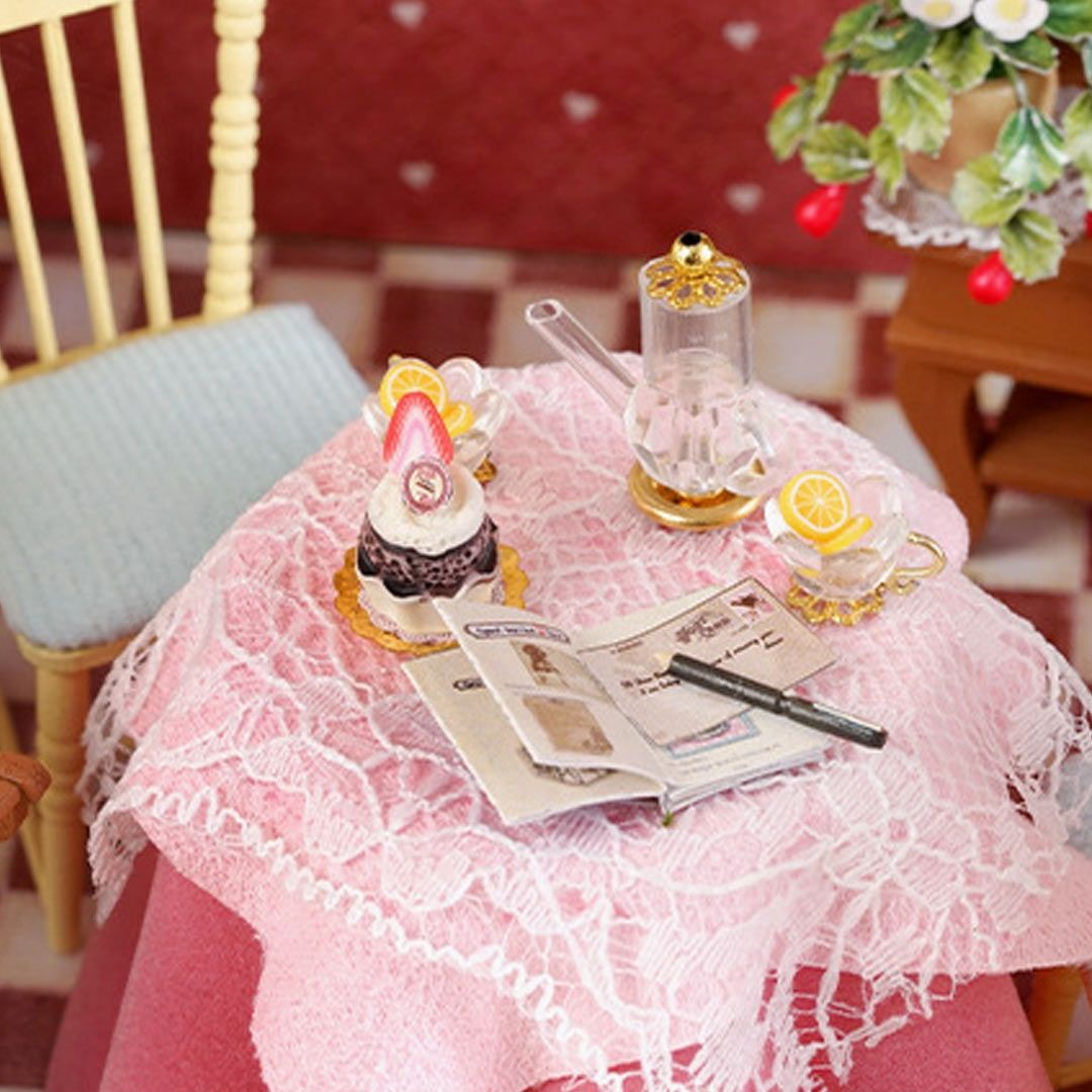 image displaying the pink tablecloth and lace decorations on table in Sweet Berries Time DIY Dollhouse