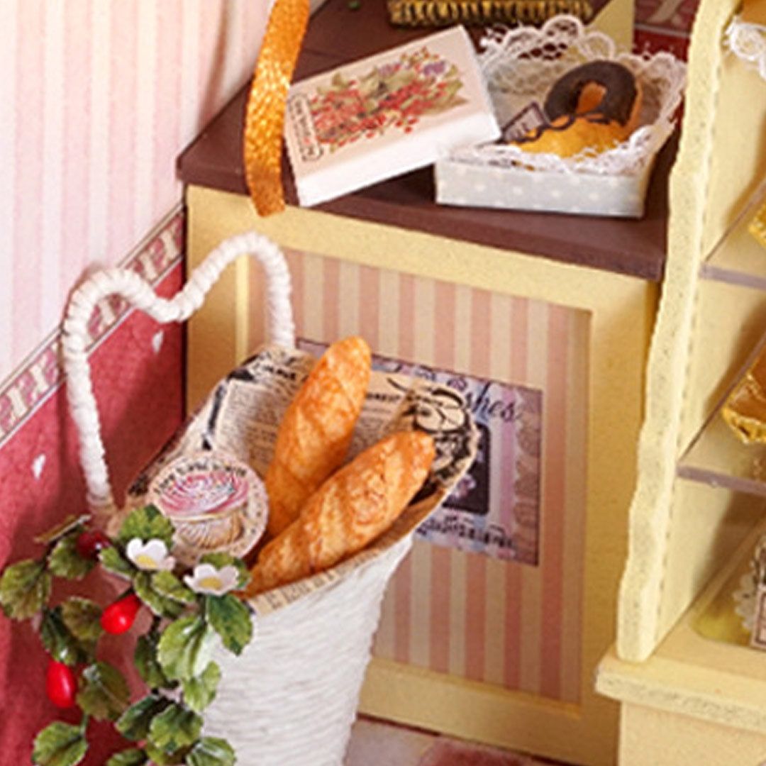 image displaying 2 miniature baguettes in a paper bag in the corner of Sweet Berries Time DIY Dollhouse Kit