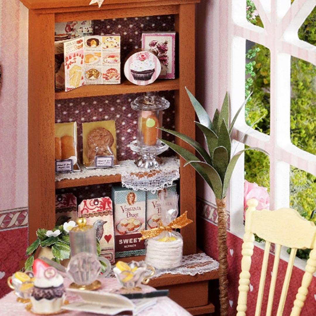 image displaying a miniature shelf full of recipe books in Sweet Berries Time DIY Dollhouse Kit