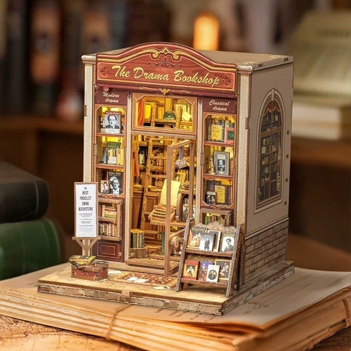 Wooden book nook model of a theater-inspired bookshop with shelves and books in a study setting