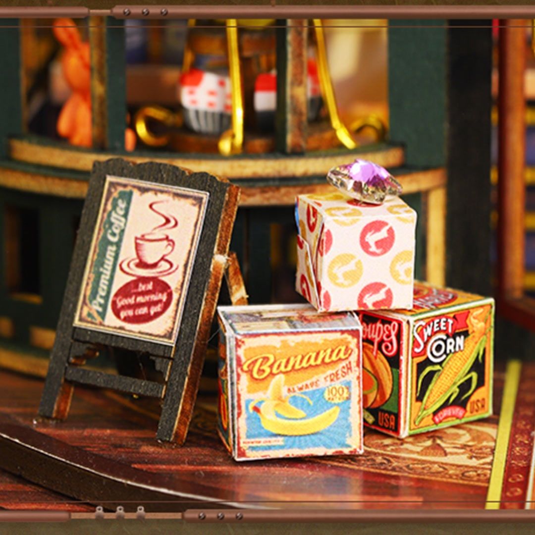 Miniature cardboard boxes with labels on a wooden surface