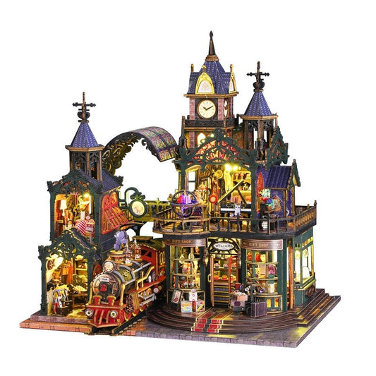 Detailed miniature house model of steampunk railway station, with various rooms and a train on a white background