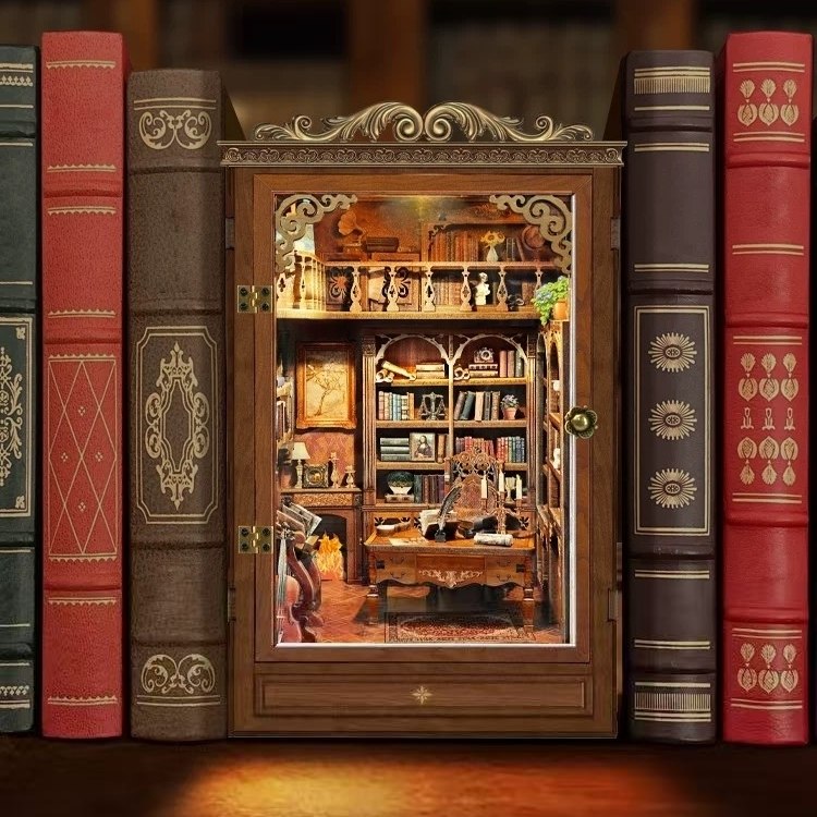 image displaying the assembled Time Book House Wooden Book Nook between books as a bookshelf insert decor