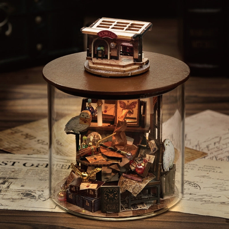 image displaying a finished Time Magic DIY Miniature House Kit in a vintage table setting