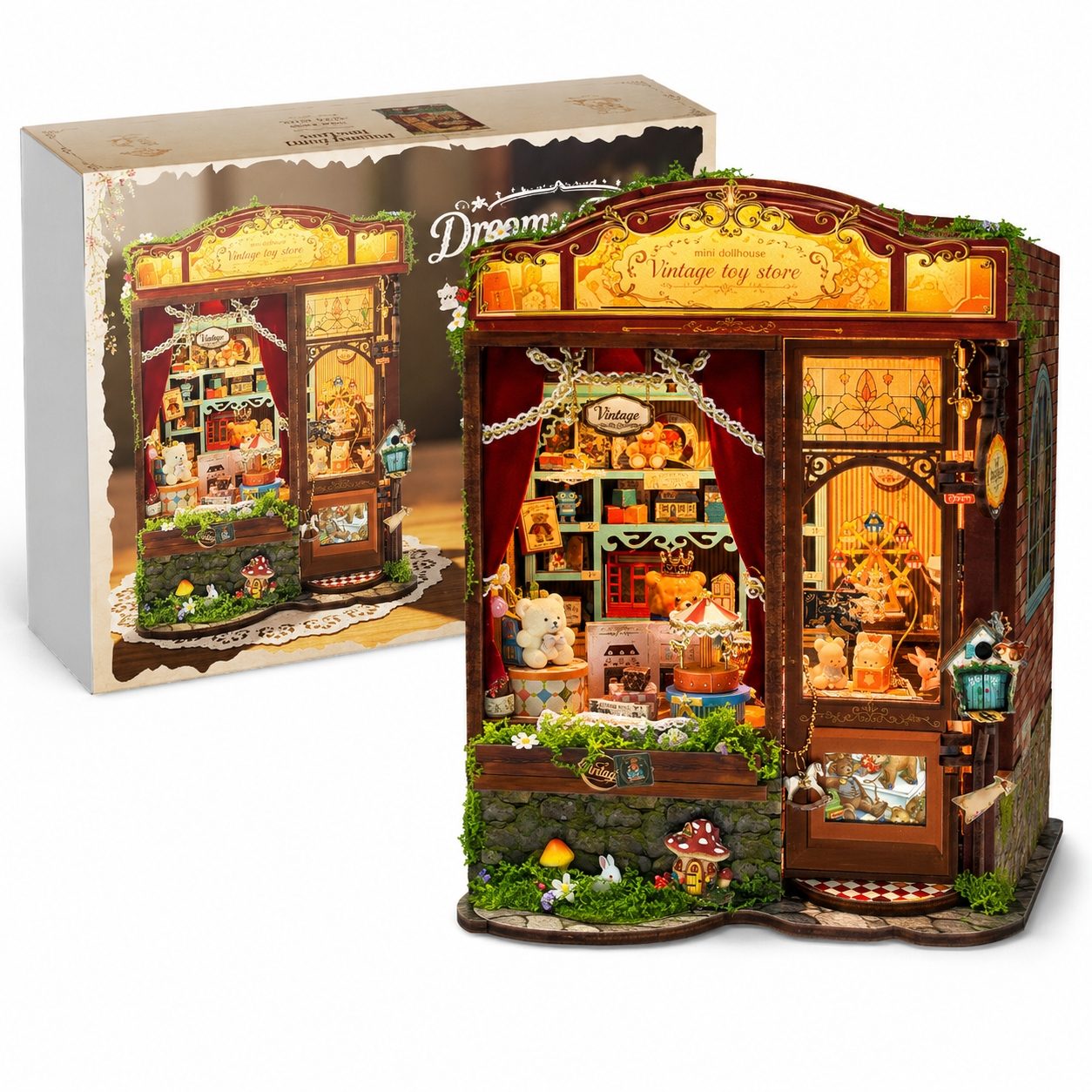 A miniature vintage toy store diorama set displayed in front of its retail box. The toy store features a dark brown wooden facade, lush green mossy accents, tiny shelves filled with colorful miniature accessories, and warm glowing interior lights.