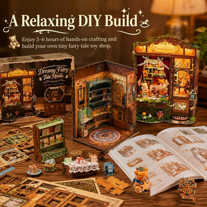 DIY miniature fairy tale house kit displayed on a wooden table with its box, open instruction booklet, small assembled pieces, and a fully lit finished model. The scene includes decorative text reading 'A Relaxing DIY Build' and 'Dreamy Fairy Tale House.