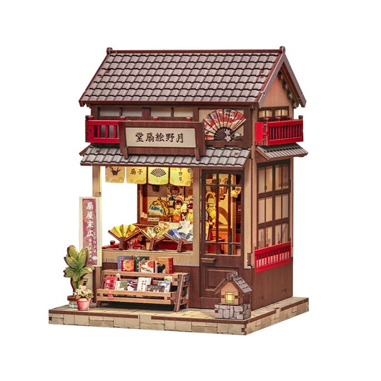Miniature House of a traditional Japanese store with wooden architecture and red accents on a white background