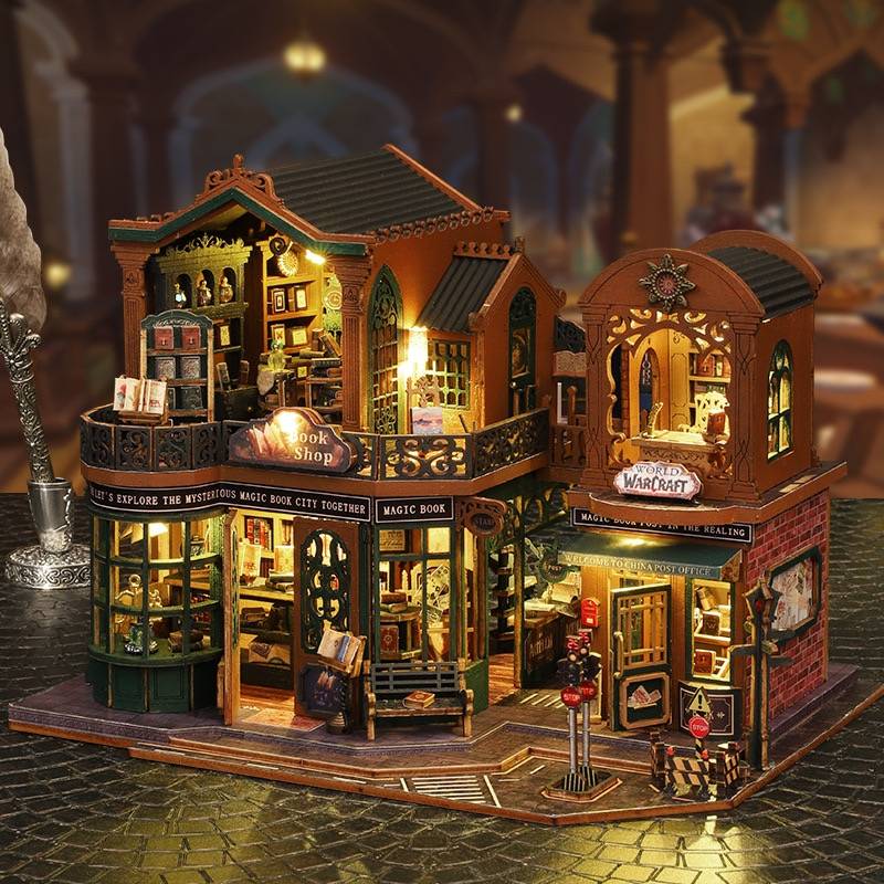 image displaying an assembled Twilight Bookstore DIY Miniature House Kit with lights on in a table setting