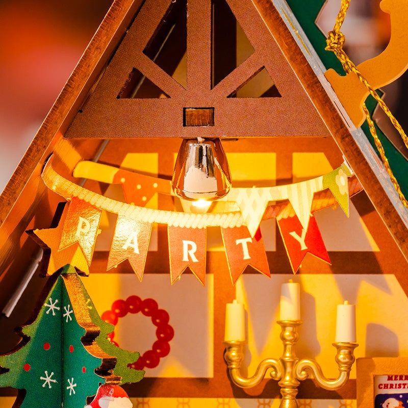 image displaying the warm light casting from the assembled Twinkling Christmas House DIY Miniature House Kit