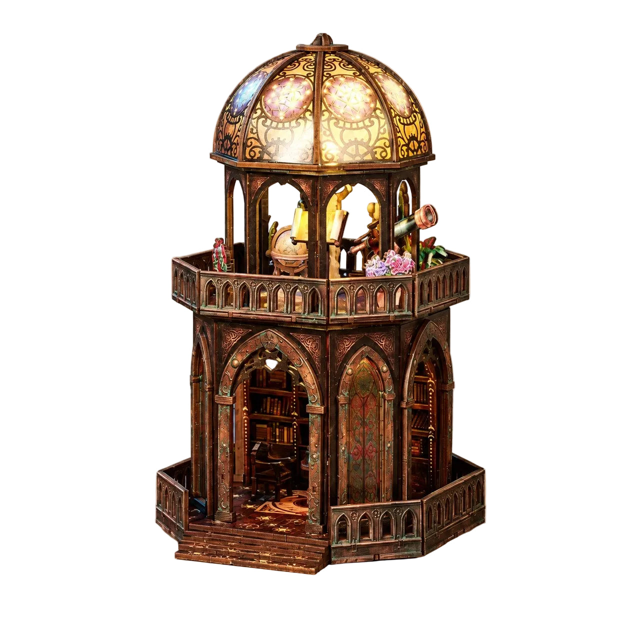 A miniature gothic-style bookshelf tower with a domed stained-glass top, lit from within and set against a plain beige background.
