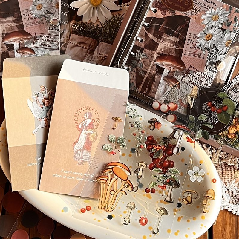 Collection of DIY Journaling Kit items including notebooks, cards, and stickers with mushroom and nature-themed designs.