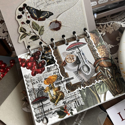 DIY Journaling Kit with illustrations of nature and objects on a textured surface.