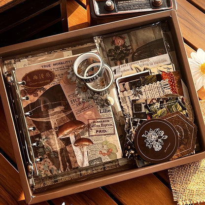 DIY Journaling Kit gift box with vintage-style pages and decorative items