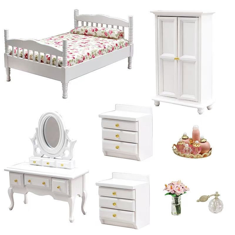 White Miniature 8-Piece Bedroom Set for dollhouses, including a bed, wardrobe, nightstand, dresser, and mirror in 1:12 scale with a sleek white finish