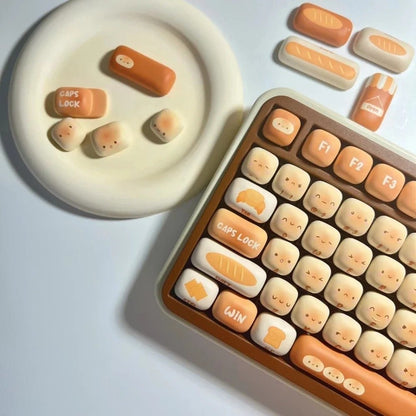 Keyboard with cute toasted bread keycaps on a white background