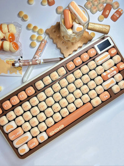 Keyboard with cartoon Toasted Bread keys on a surface with candy-themed items