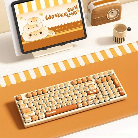 Keyboard with toasted bread design keycaps on a desk setup, featuring a monitor and toaster.