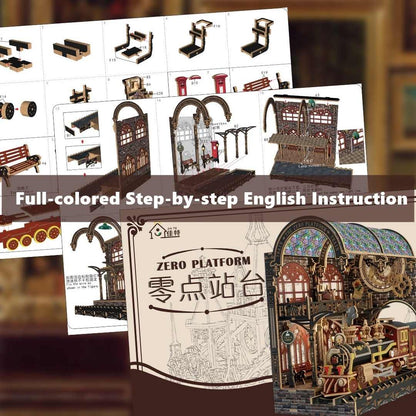 Miniature Model train set with assembly instructions and completed model on a blurred background